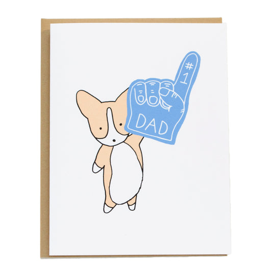 corgi holding up a #1 blue foam finger that says dad