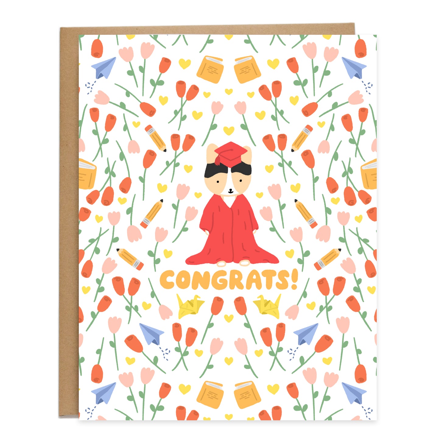 A tricolor corgi in the center wearing a red gown that's dragging on the floor and a red cap, surrounded by a pattern of red roses, pink tulips, yellow hearts, pencils, books, yellow paper cranes, and paper planes. Card reads, congrats, in orange bubbly handwriting