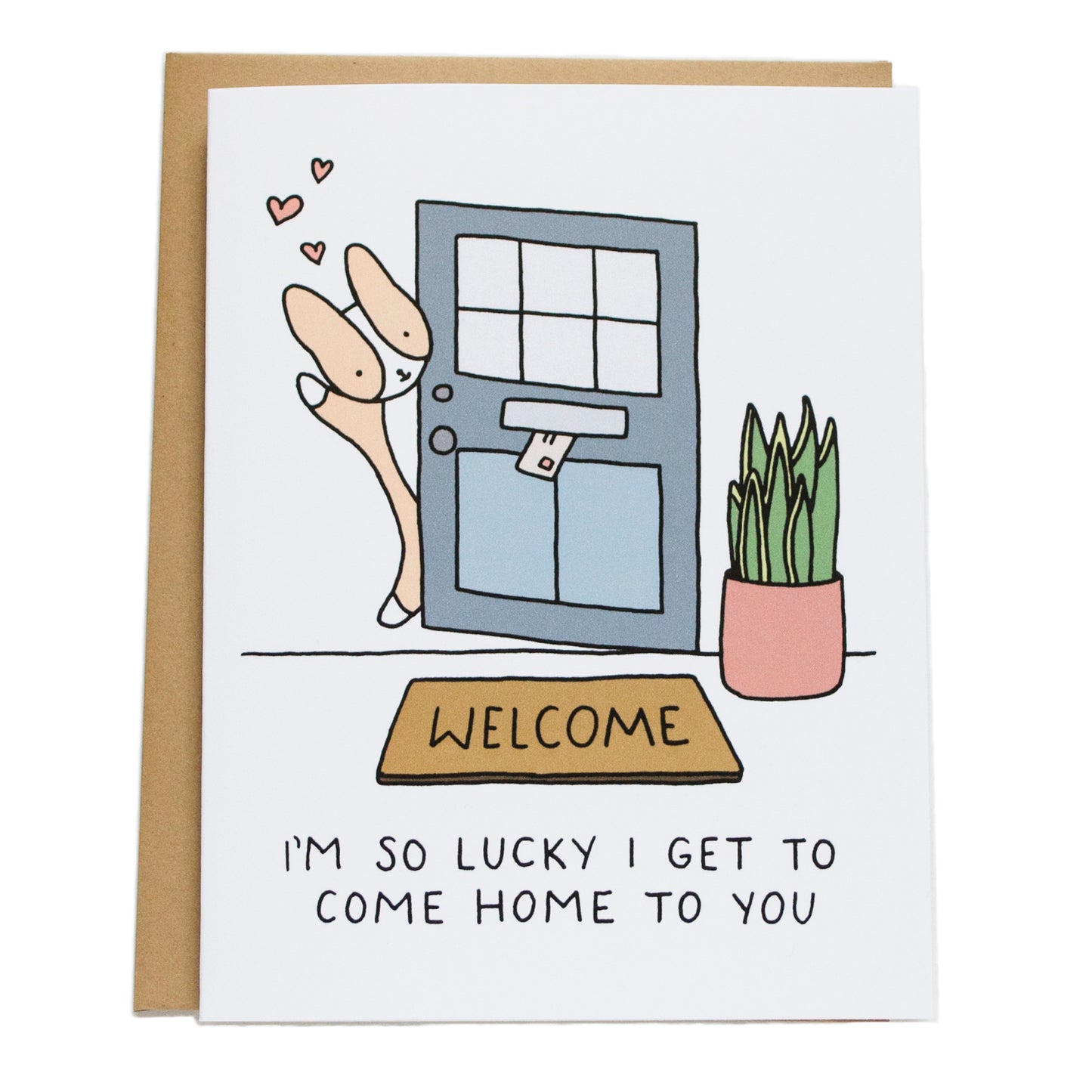 corgi waving at door with welcome mat and snake plant decorations and card reads I'm so lucky I get to come home to you