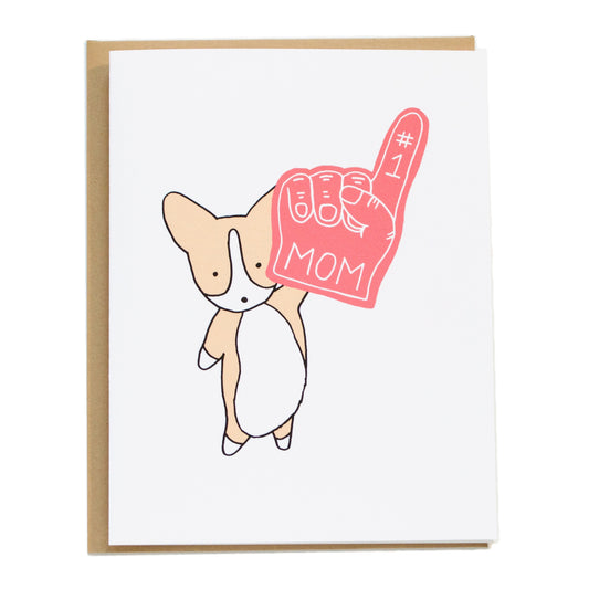 corgi holding up a #1 red foam finger that says mom