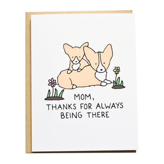 a corgi mom and baby corgi sitting on top of the mom with flowers next to them, the card reads, mom, thanks for always being there