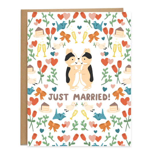 Two tricolor corgis dancing in the center, surrounded by a pattern of autumnal themed colors of hearts, roses, greenery, slices of chocolate cake, blue cranes, white birds, champagne, and ribbons