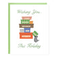 Greeting card with text on top that reads, 'Wishing you...' and in the middle an illustration of a pile of colorfully wrapped boxes that each reads, 'safety, laughter, a warm meal, joy, gratitude' with a rat running up to add another box that reads, 'courage.' On bottom the text reads, 'This Holiday'