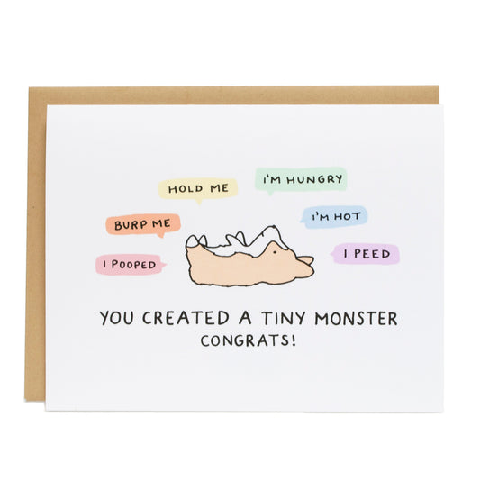 a baby corgi lying on its back with colorful quote bubbles around it that say i pooped, burp me, hold me, i'm hungry, i'm hot, and i peed. at the bottom the card reads you created a tiny monster congrats!