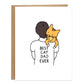 dad with short brunette hair with their back turned is holding an orange cat on their shoulder, on the shirt it reads best cat dad ever