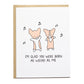 two corgis dancing with music notes around them, the card reads, i'm glad you were born as weird as me