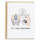 two corgis wearing sheet masks on that have funny cat and panda designs on them, one of them says, let's get sheet faced, and the bottom of the card reads, it's your birthday!