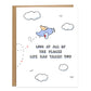 a drawing of a corgi flying in a cornflower blue plane surrounded by clouds and the card reads, look at all of the places life has taken you in a bubbly style