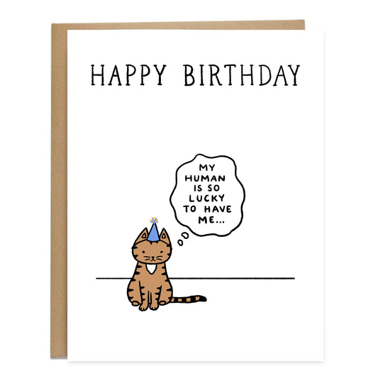 A birthday card with a brown tabby cat standing off to the side with a birthday hat on, a thought bubble reads, my human is so lucky to have me. The card on top reads, happy birthday, in big letters