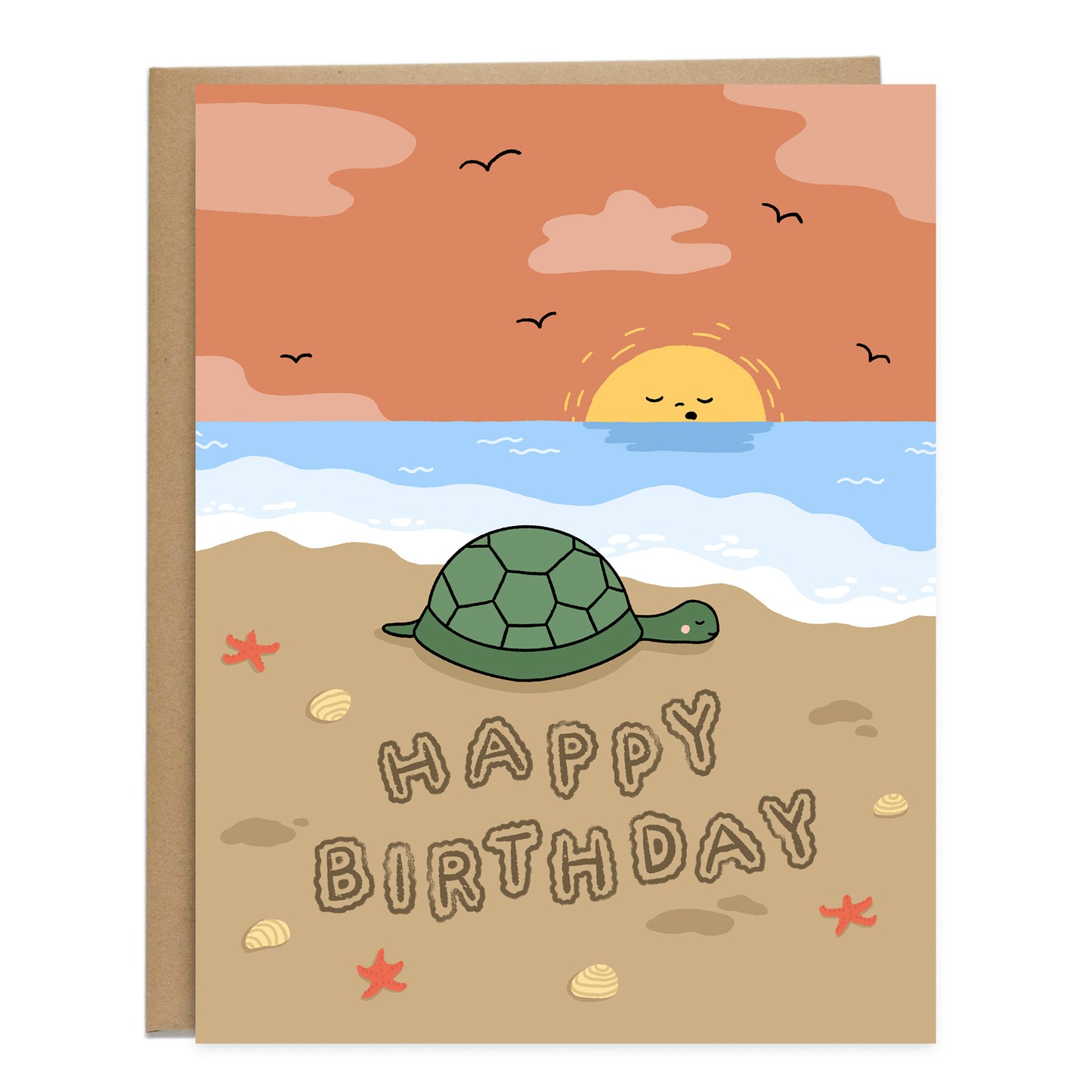 A birthday card with a drawing of a turtle sleeping on the beach shoreline, and the sun setting in the background with a sleepy face. The card reads, happy birthday, and is written in the sand