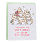 drawing: pile of corgi butts with one wrapped in holiday ribbon. card reads, wishing you buttloads of cheer this holiday