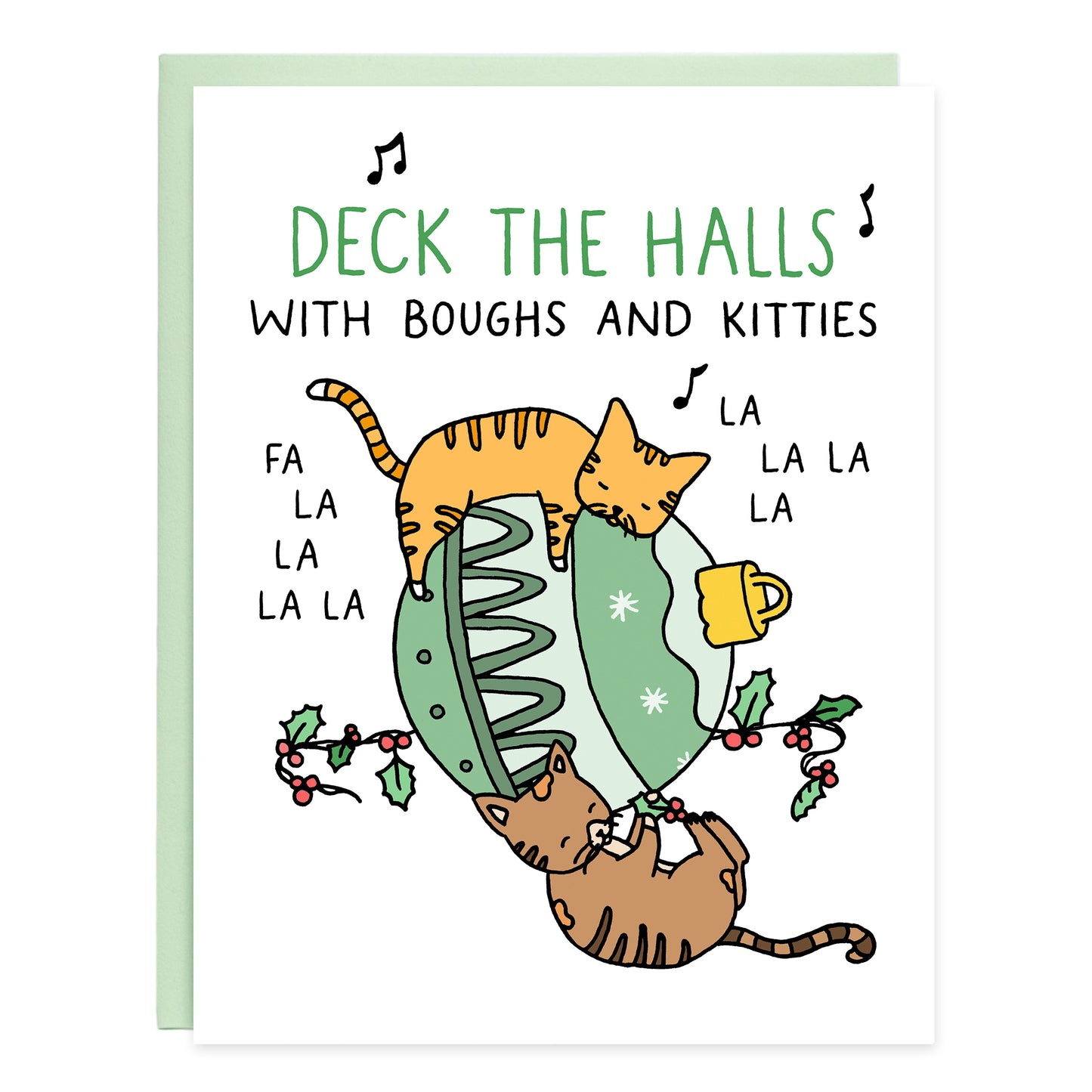 a orange tabby cat sleeping on top hugging a large green ornament and a brown tabby on the ground playing with part of a bough of holly. the card reads, deck the halls with bough and kitties