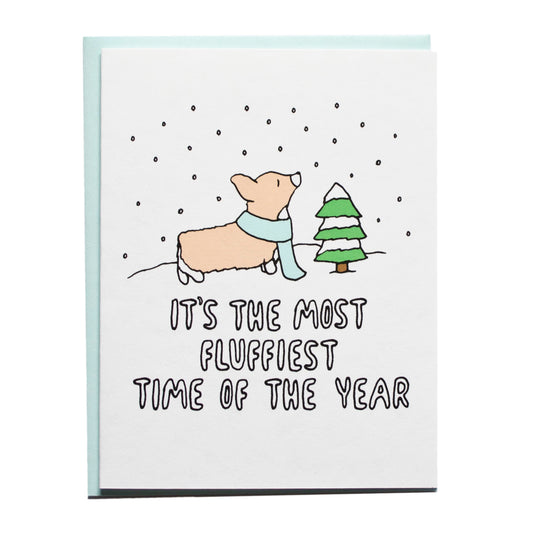 a corgi with falling snow. card reads, it's the most fluffiest time of the year