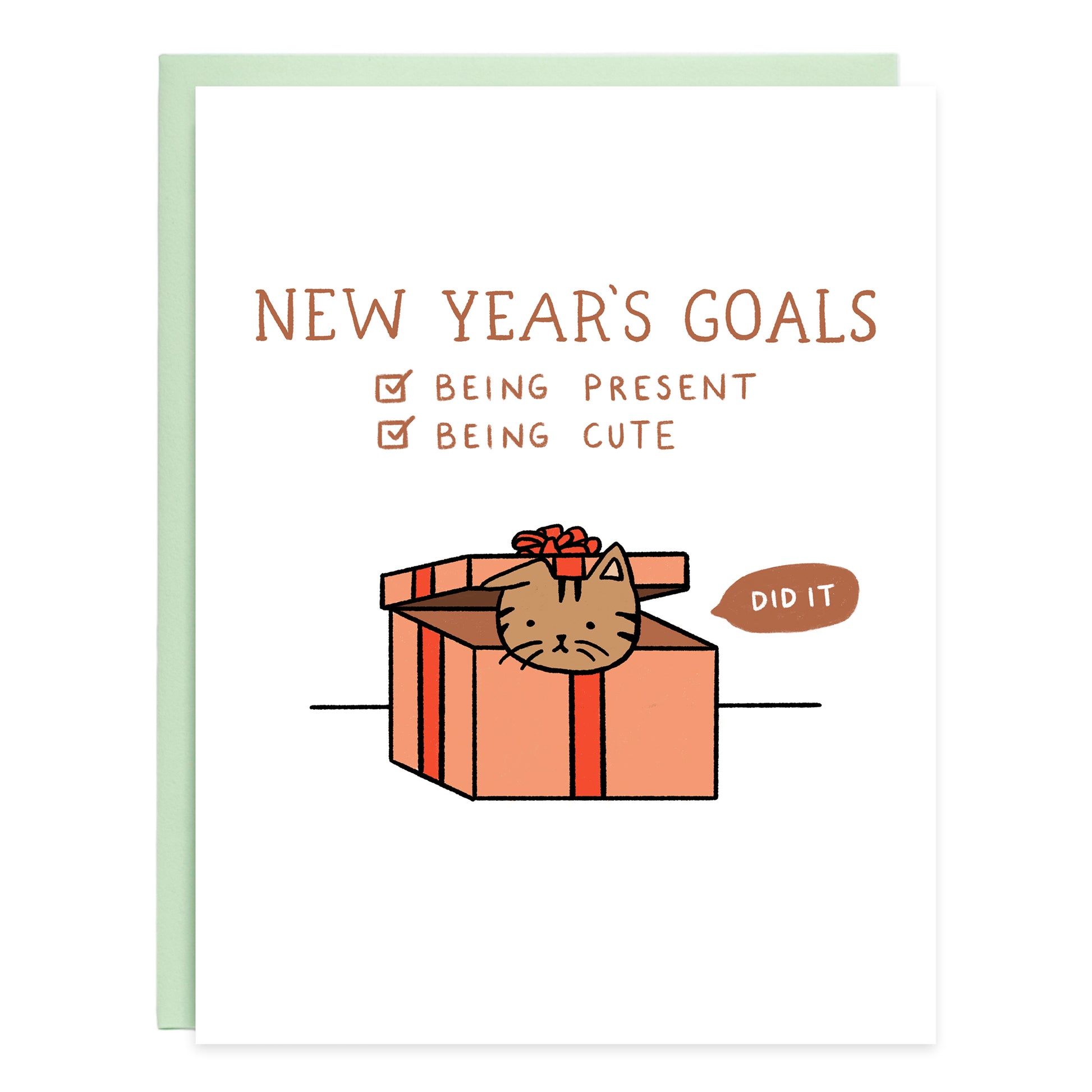 At the top the card reads, New Year's Goals. Underneath is a checklist and the two goals checked off  are being present and being cute. A drawing of a brown tabby cat inside of a red gift box with a quote bubble that says, did it