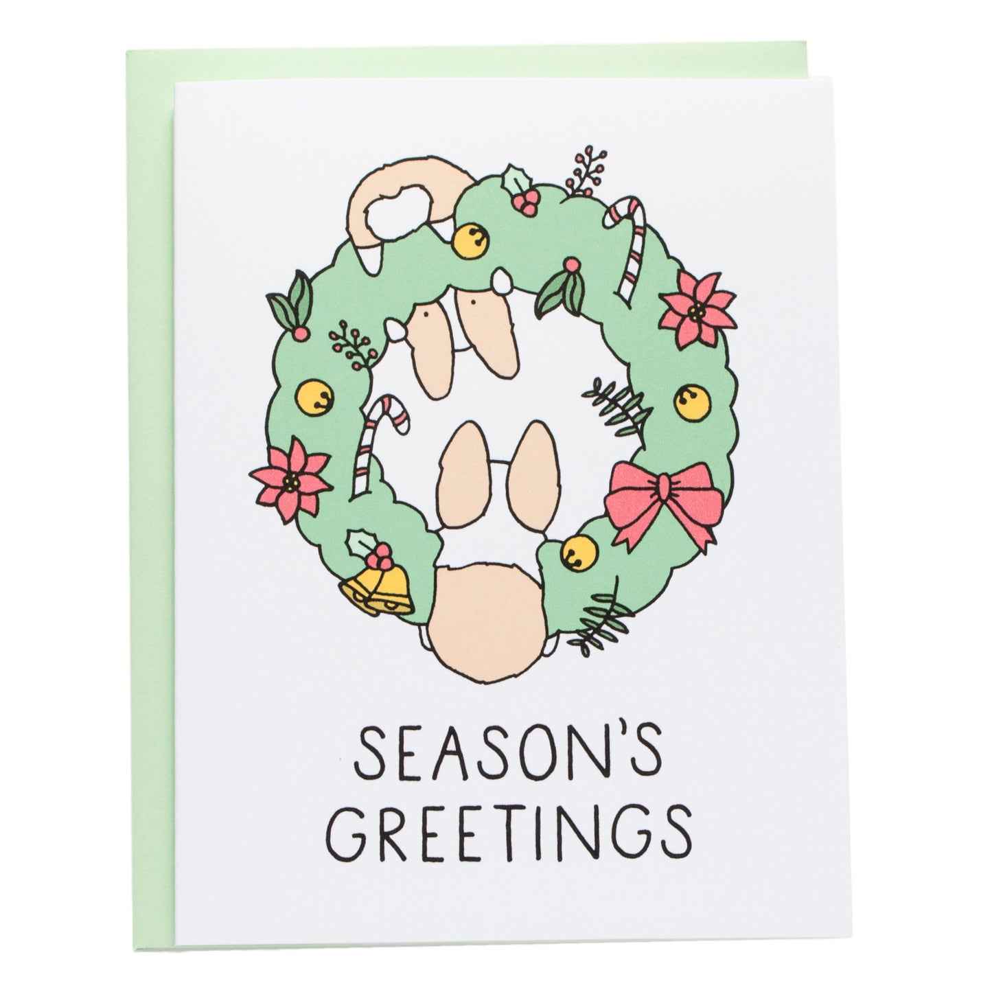 two corgis hanging from a green wreath covered with bells, bows, candy canes, and boughs of holly. card reads, season's greetings