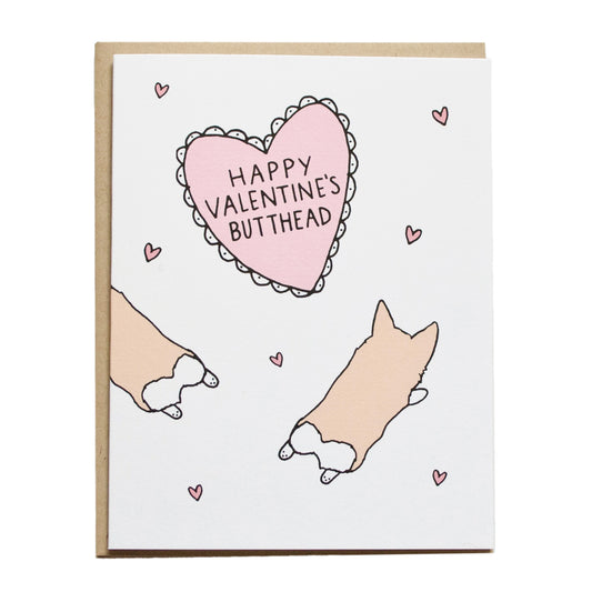 two corgis laying down with a view of their back side, inside of a pink valentines heart it reads, happy valentine's butthead