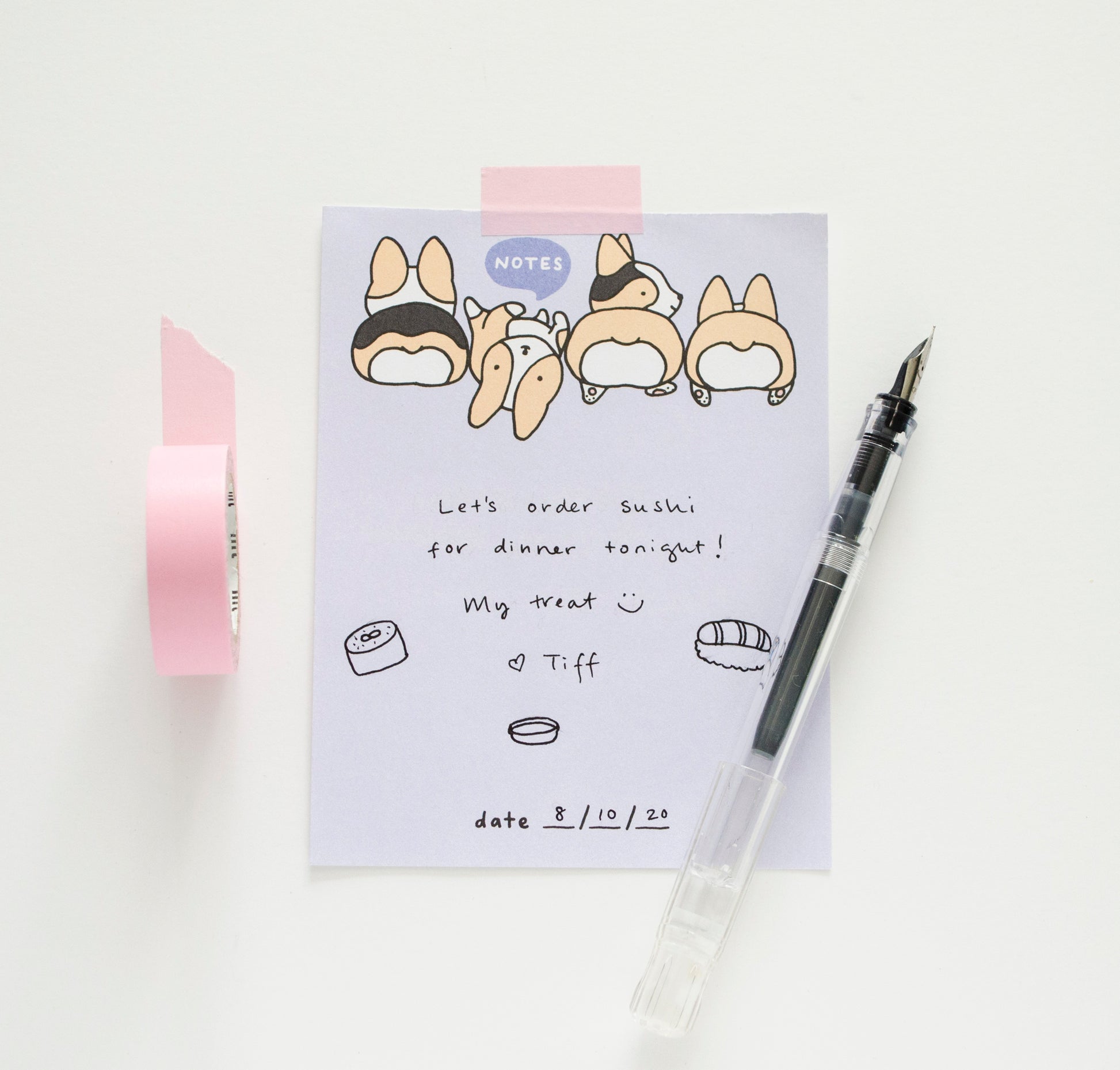 blank corgi notepad styled with pink washi tape and fountain pen