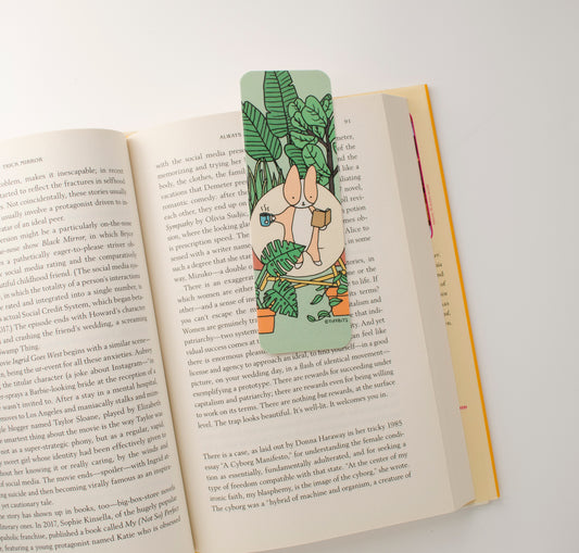 A book open with the bookmark laying on page