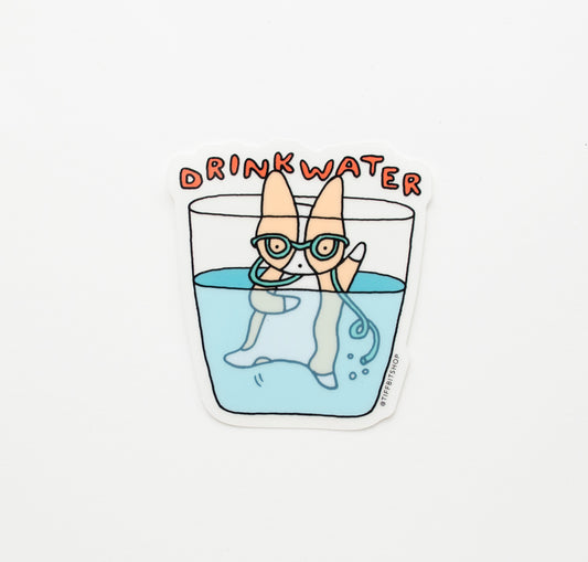 a sticker with a corgi in a cup drinking from a silly curly straw